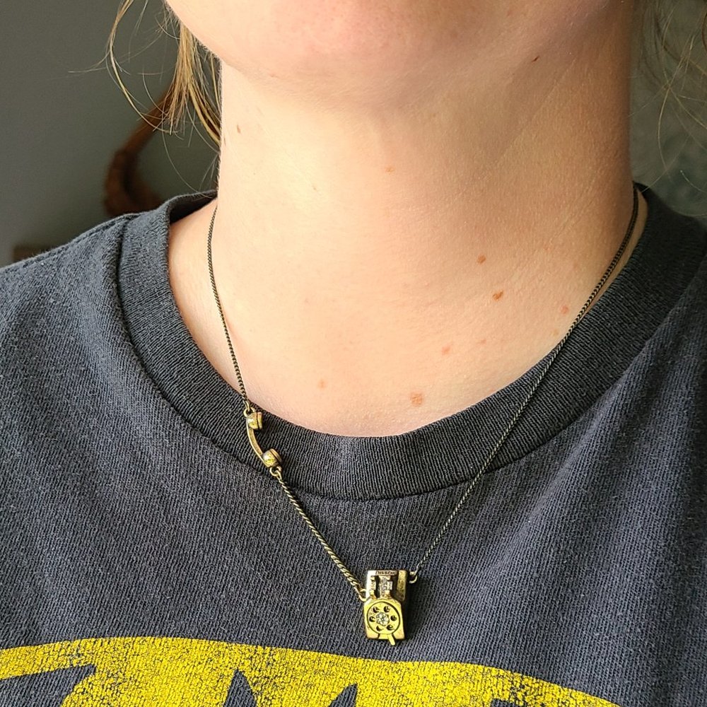 Gold-tone Fossil rotary phone necklace w/glitz